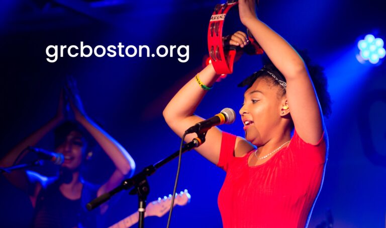 GRCB card with two teenager girls singing onstage