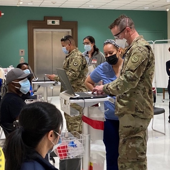 Army medics and Upham's staff giving Covid vaccines