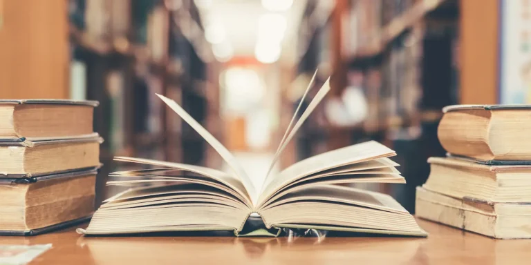 Open book on a table in a library